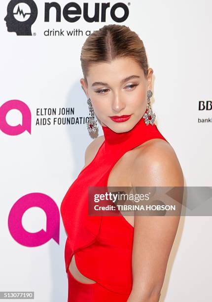 Hailey Rhode Baldwin poses as she arrives at the 2016 Elton John AIDS Foundation Academy Awards Viewing Party in West Hollywood, California, on...