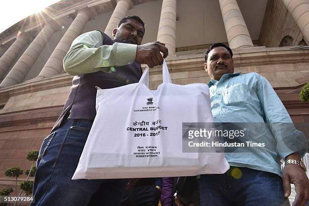 People shows copy of Central Budget after tabled in Parliament at Parliament House during Budget Session on February 29, 2016 in New Delhi, India....