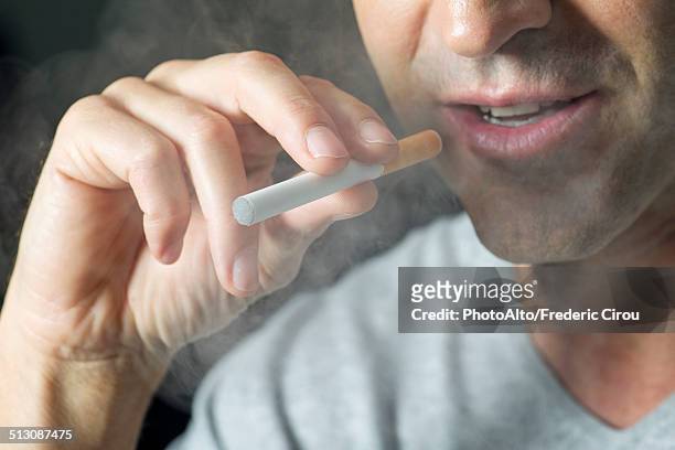 man smoking electonic cigarette, cropped - emphysema stock-fotos und bilder