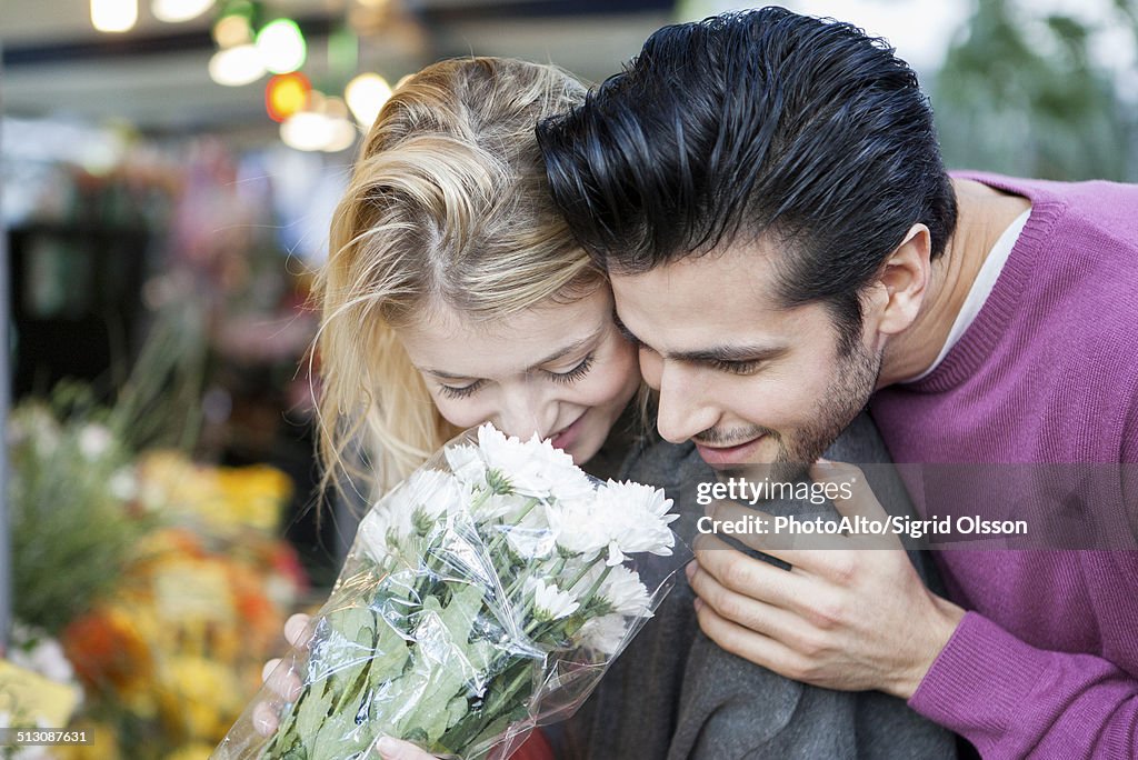 Young couple with flower bouquet