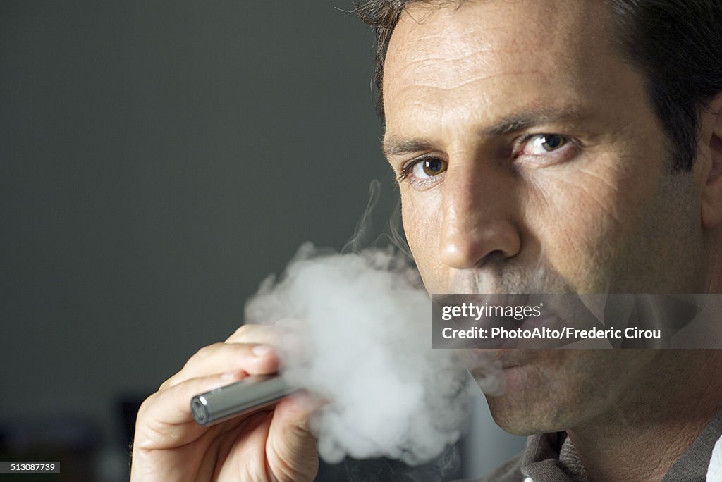 Man smoking electonic cigarette