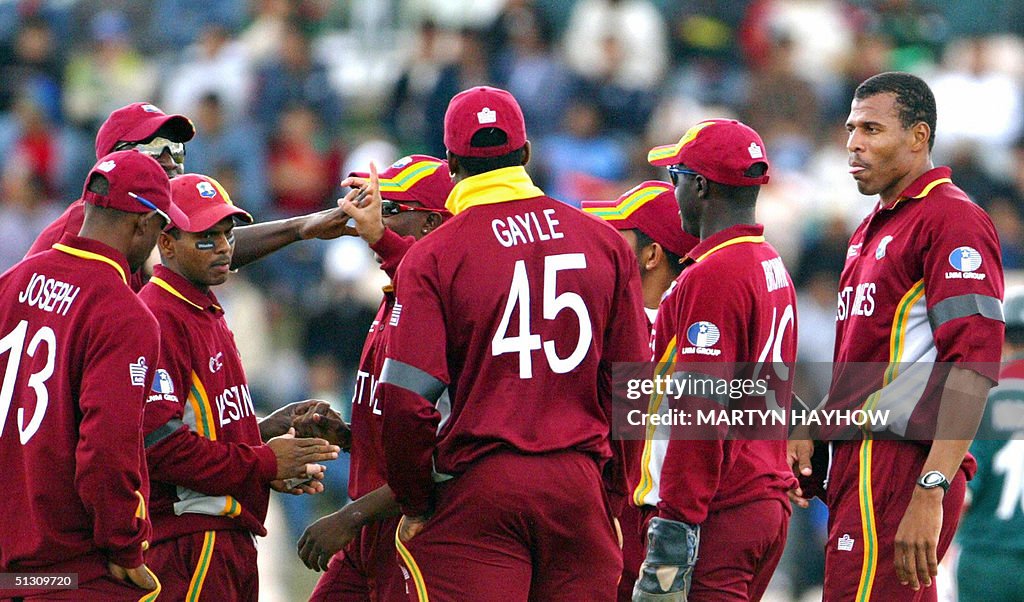 West Indies' Mervyn Dillon (R) who had a