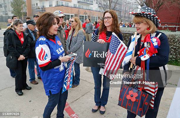 Suzanne Blackstone of Plano,Texas, Debbie Edwards of Plano, Texas, and Diane Benjamin of Dallas, wait in line to enter the building as Republican...