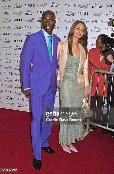 Oswald Boetang and his wife attend the "Its Fashion" Gala Evening in aid of Macmillan Cancer Relief, hosted by Jaguar and Vogue on June 11, 2001 in...