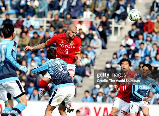 Robin Simovic of Nagoya Grampus heads the ball to score his team's first goal during the J.League match between Jubilo Iwata and Nagoya Grampus at...