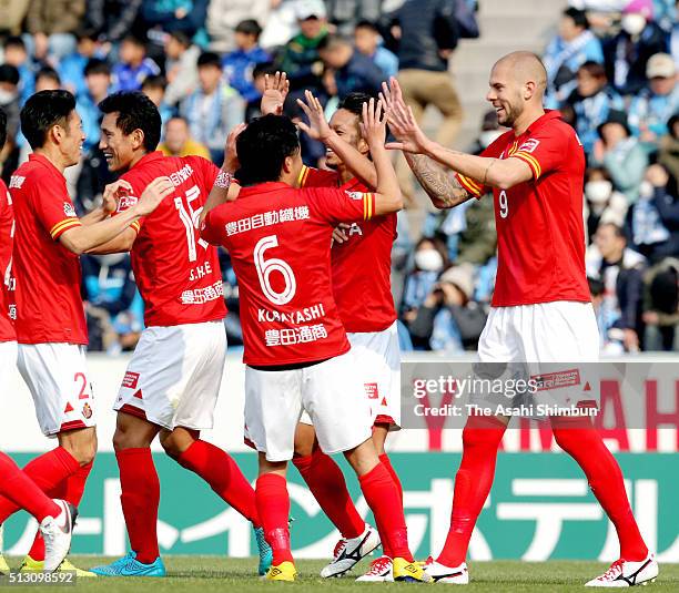 Robin Simovic of Nagoya Grampus celebrates scoring his team's first goal with his team mates during the J.League match between Jubilo Iwata and...