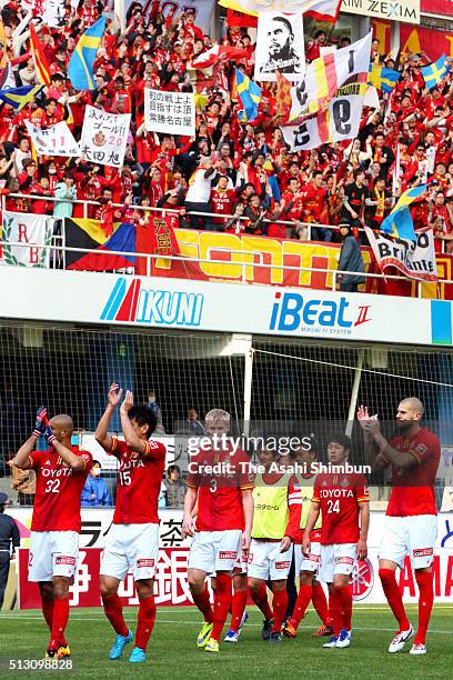 Nagoya Grampus players applaud away supporters after their 1-0 win in the J.League match between Jubilo Iwata and Nagoya Grampus at the Yamaha...