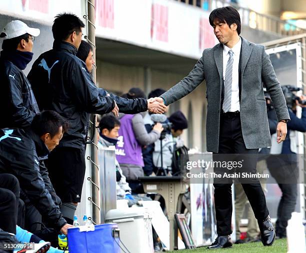 Hiroshi Nanami head coach of Jubilo Iwata shake hands with his team staff after the J.League match between Jubilo Iwata and Nagoya Grampus at the...