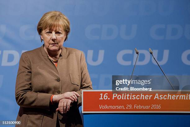Angela Merkel, Germany's chancellor, stands on stage before addressing a Christian Democratic Party local election campaign rally in Volkmarsen,...