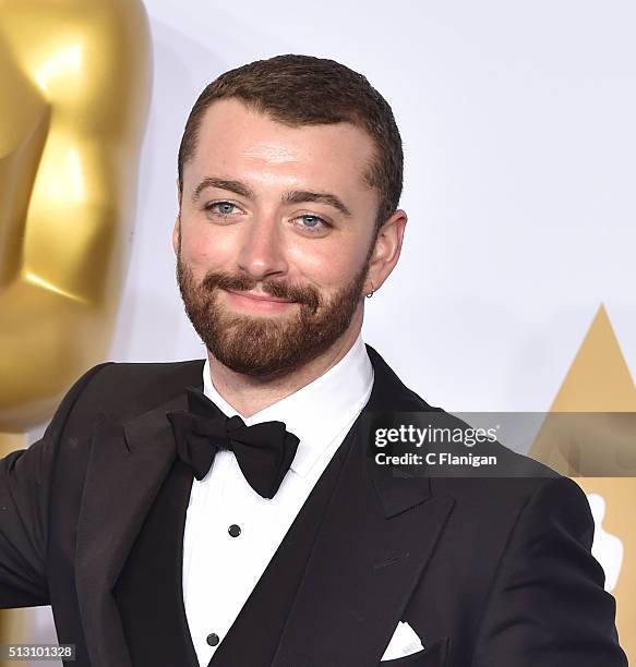 Singer-songwriter Sam Smith, winners of the Best Original Song award for 'Writing's on the Wall' from 'Spectre,' poses in the press room during the...