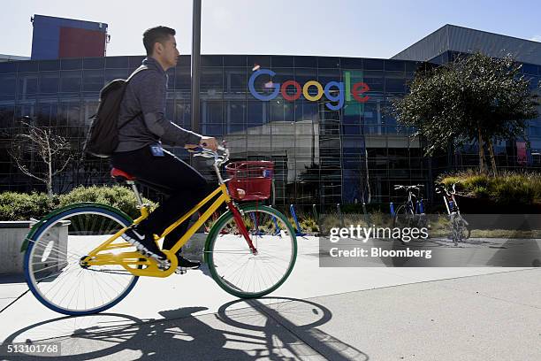 Cyclist rides past Google Inc. Offices inside the Googleplex headquarters in Mountain View, California, U.S., on Thursday, Feb. 18, 2016. Google,...