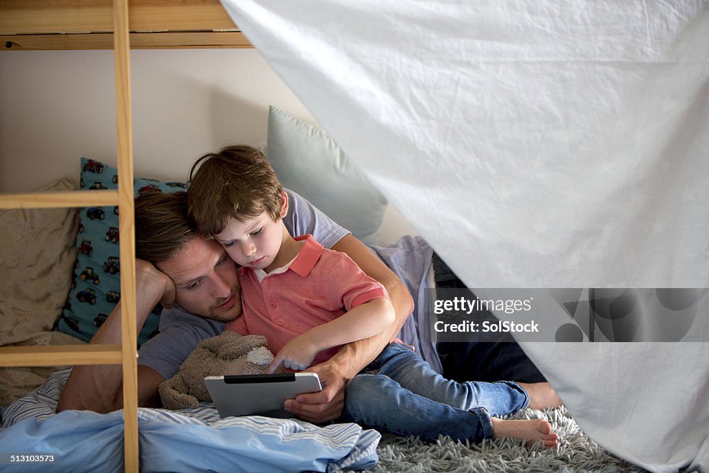 Father and Son Using a Electronic Tablet