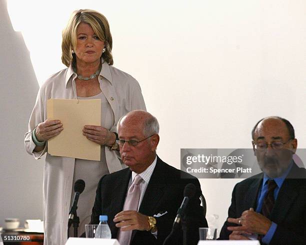 Martha Stewart stands next to lawyers and company representitives before making a statement to the media that she has decided to surrender for prison...