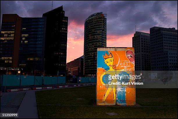 Protected piece of the Berlin Wall that was saved from being destroyed or carted off to a museum, stands as a memorial in the heart of Berlin's...