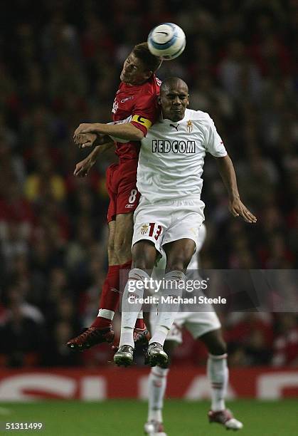 Steven Gerrard of Liverpool clashes with Douglas Maicon of Monaco during the UEFA Champions League Group A match between Liverpool and AS Monaco at...