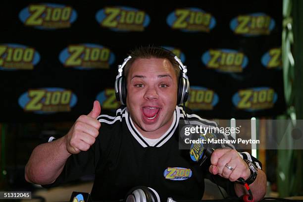 Greg T broadcasts as part of the Z100 Pimp My Summer Contest at Times Square Studios September 15, 2004 in New York City. Nelly gave a Chrysler 300...