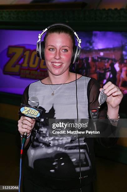 Contest winner Melissa Kennedy recieves car keys as part of the Z100 Pimp My Summer Contest at Times Square Studios September 15, 2004 in New York...