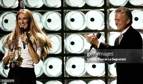 Actor Michael Douglas presents Canadian pop diva Celine Dion the Diamond Award, a special honor for being the top-selling female artist of all time,...