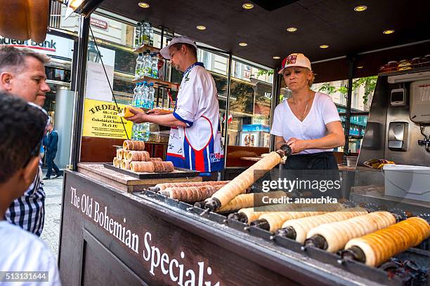 people buying famous trdelnik in prague - trdelník stock pictures, royalty-free photos & images