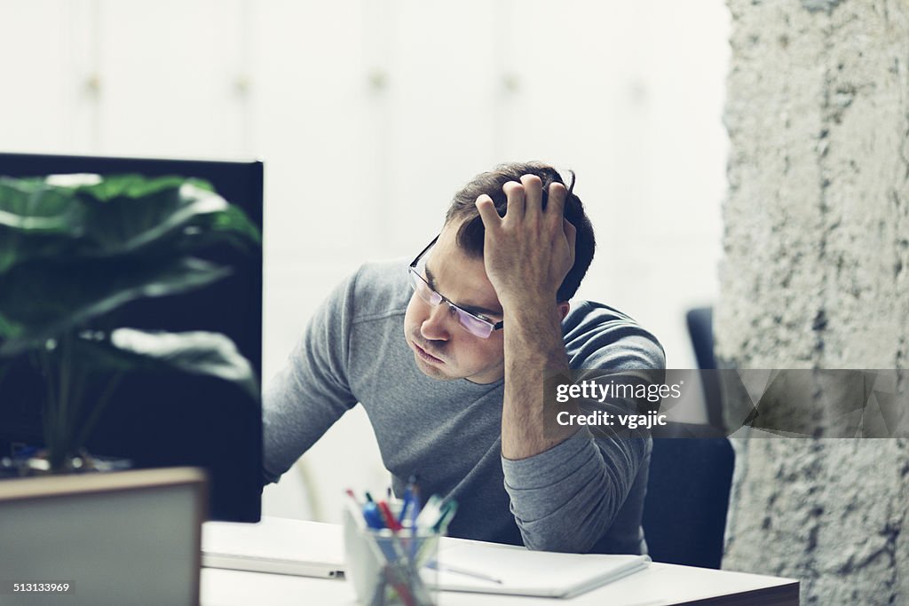 Worried businessman in office.