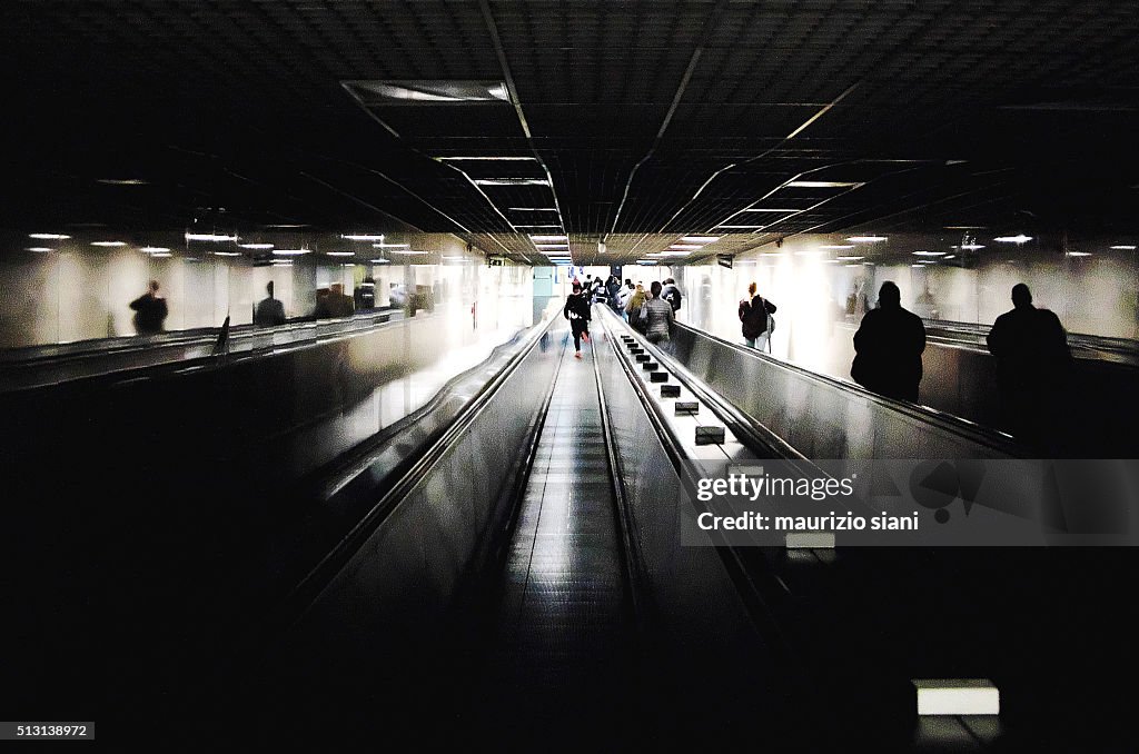 People Walking In Underground Walkway