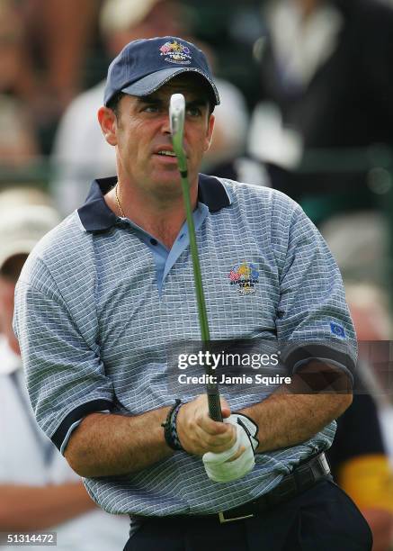 European team player Paul McGinley of Ireland watches his tee shot on the third hole during the final practice day for the 35th Ryder Cup Matches at...