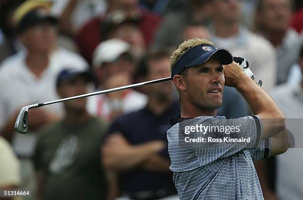 European team player Padraig Harrington Ireland watches his tee shot on the ninth hole during the final practice day for the 35th Ryder Cup Matches...