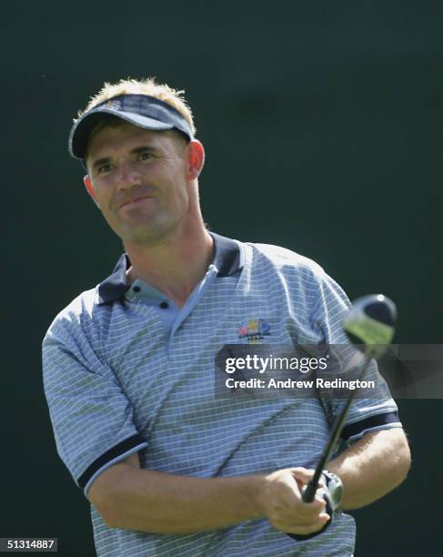 European team player Padraig Harrington of Ireland watches his tee shot on the 11th hole during the final practice day for the 35th Ryder Cup Matches...