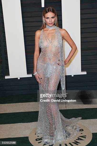Model Natasha Poly arrives at the 2016 Vanity Fair Oscar Party Hosted by Graydon Carter at the Wallis Annenberg Center for the Performing Arts on...