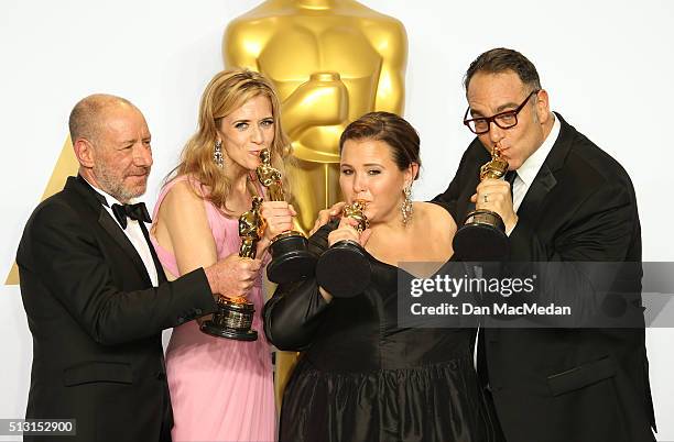 Producers Steve Golin, Blye Pagon Faust, Nicole Rocklin and Michael Sugar, winners of the Best Picture award for 'Spotlight,' pose in the press room...