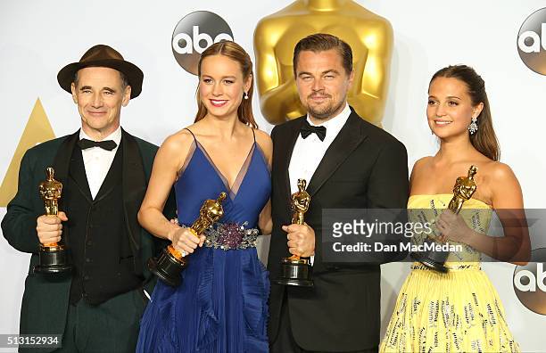 Actors Mark Rylance, Brie Larson, Leonardo DiCaprio and Alicia Vikander pose in the press room at the 88th Annual Academy Awards at Hollywood &...