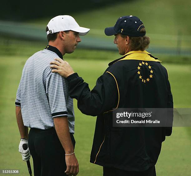 European team player Sergio Garcia of Spain chats with European Captain Bernhard Langer during the final practice day for the 35th Ryder Cup Matches...