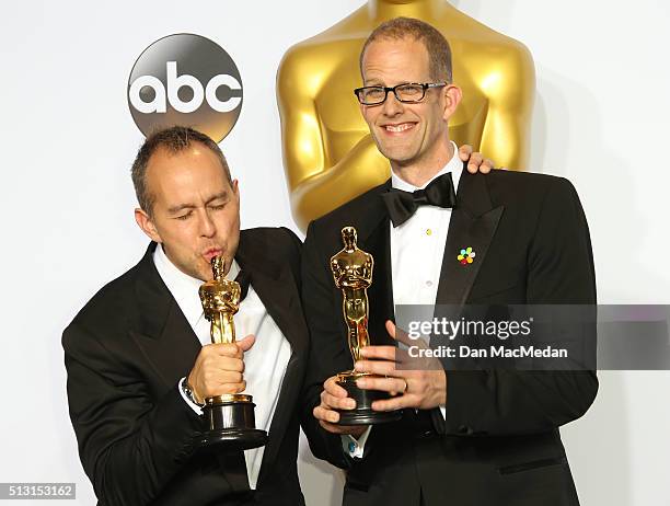 Jonas Rivera and Pete Docter, winners for Best Animated Feature Film for 'Inside Out,' pose in the press room at the 88th Annual Academy Awards at...