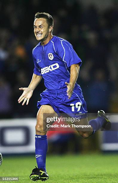 Dennis Wise of Millwall celebrates his goal during the UEFA Cup first round, first leg match between Millwall and Ferencvaros at The New Den on...