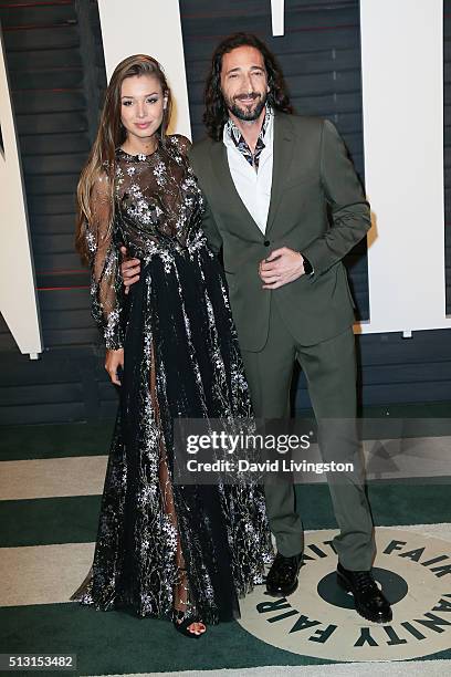 Actor Adrien Brody and Lara Leito arrive at the 2016 Vanity Fair Oscar Party Hosted by Graydon Carter at the Wallis Annenberg Center for the...