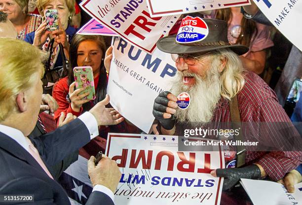 Republican presidential candidate Donald Trump greets supporters during his rally at Valdosta State University in Valdosta, Georgia on February 29,...