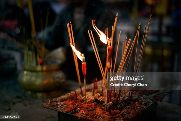 praying at chinese hungry ghosts month - hungry ghost festival stock pictures, royalty-free photos & images