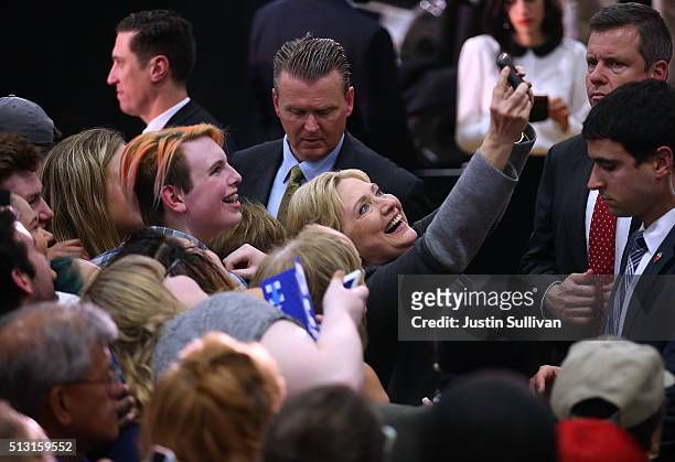 Democratic presidential candidate former Secretary of State Hillary Clinton takes a selfie with a supporter at Lake Taylor Senior High School on...