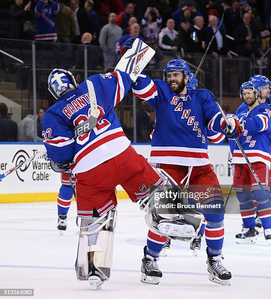 Antti Raanta and Keith Yandle of the New York Rangers celebrate the Rangers 2-1 victory against the Columbus Blue Jackets at Madison Square Garden on...