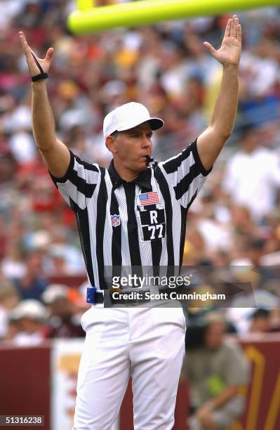 Referee Terry McAulay signals a touchdown during the game between the Tampa Bay Buccaneers and the Washington Redskins on September 12, 2004 at FedEx...