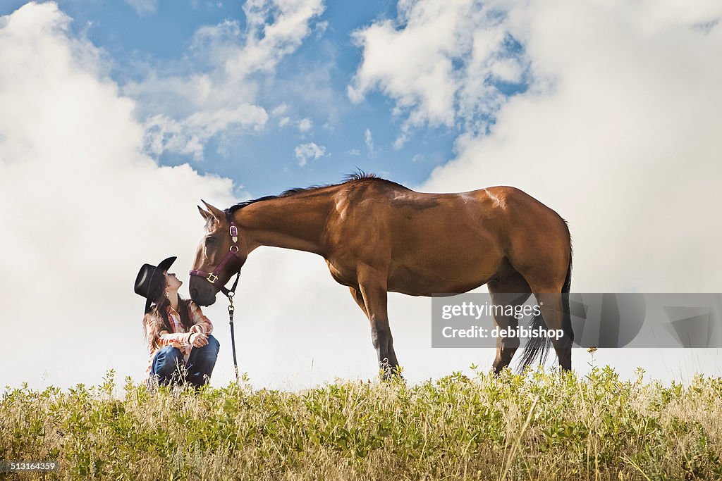 Young Woman Enjoying a Summer Day With Her Horse