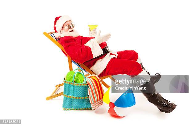 santa claus beach vacation after christmas holiday season on white - santa claus lying stockfoto's en -beelden