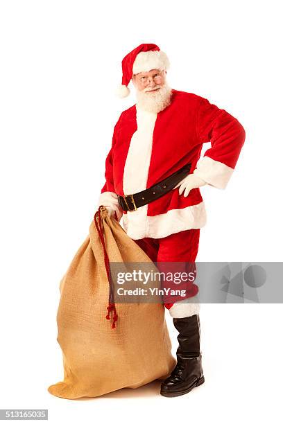 santa claus with bag of christmas gift on white background - costums stock pictures, royalty-free photos & images