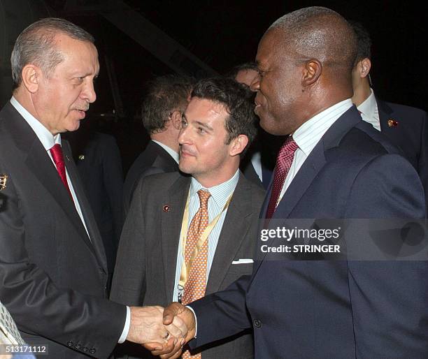 Ghanian Vice President Kwesi Bekoe Amissah-Arthur shakes hand with Turkish President Recep Tayyip Erdogan , upon his arrival in Accra, on February...