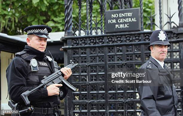 Armed police officer's patrol outside The Houses of Parliament on September 17, 2004 in London, England. Britain's Commons leader Peter Hain has...