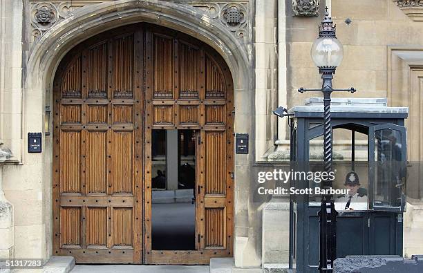 Police officer sits in his booth outside of the Chancellor's Gate entrance to Britain's Houses of Parliament on September 17, 2004 in London,...