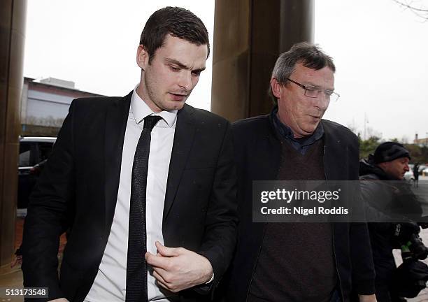 Footballer Adam Johnson arrives with his father Dave at Bradford Crown Court for day thirteen of the trial where he is facing child sexual assault...