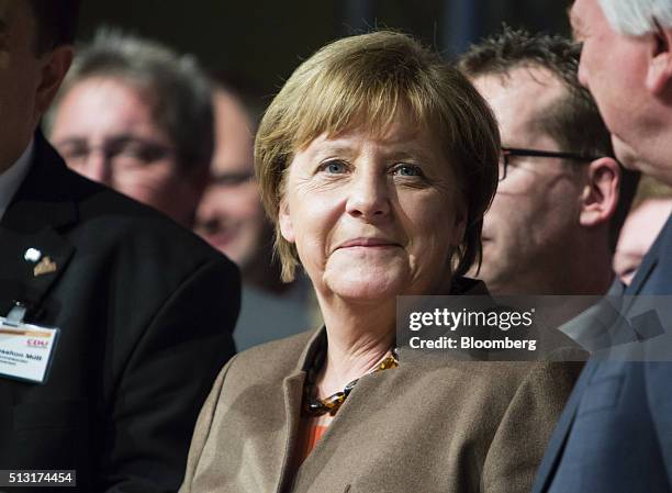 Angela Merkel, Germany's chancellor, reacts during a Christian Democratic Party local election campaign rally in Volkmarsen, Germany, on Monday, Feb....