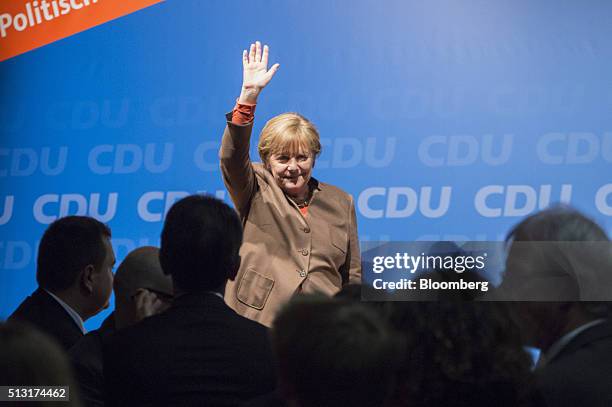 Angela Merkel, Germany's chancellor, waves to supporters during a Christian Democratic Party local election campaign rally in Volkmarsen, Germany, on...