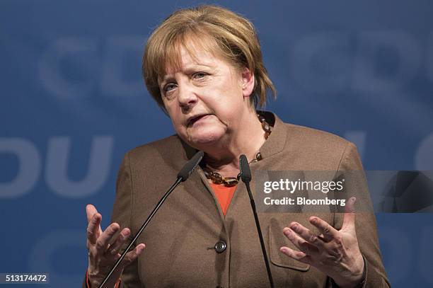 Angela Merkel, Germany's chancellor, gestures as she speaks during a Christian Democratic Party local election campaign rally in Volkmarsen, Germany,...